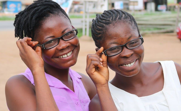two girls in glasses smiling